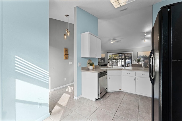 kitchen featuring pendant lighting, black refrigerator, stainless steel dishwasher, and white cabinets