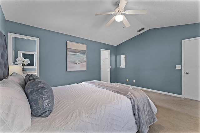 bedroom featuring carpet, lofted ceiling, and ceiling fan