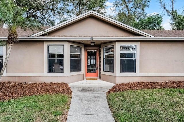 entrance to property with a yard