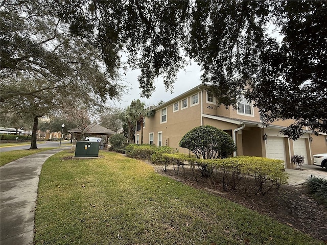 exterior space with a gazebo and a garage