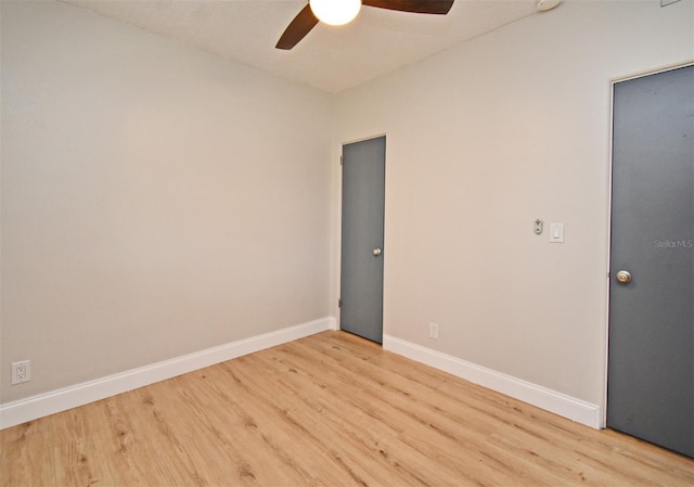 spare room with ceiling fan and light hardwood / wood-style floors