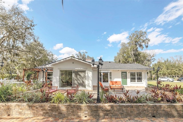 rear view of house featuring a patio