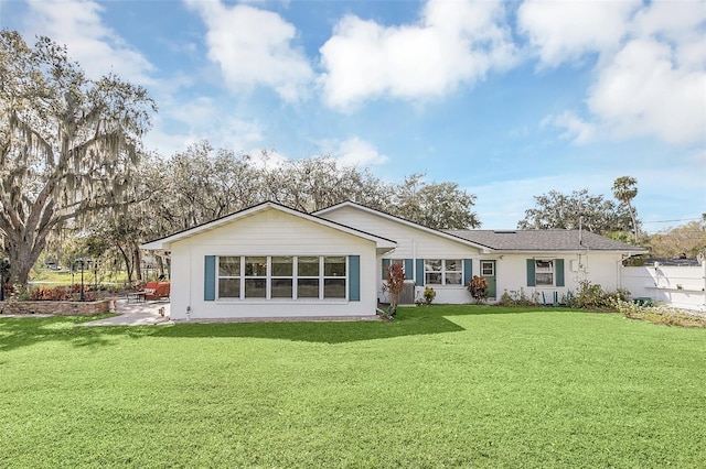 back of house featuring a yard