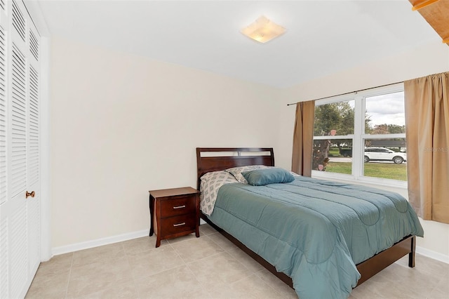 bedroom with light tile patterned flooring