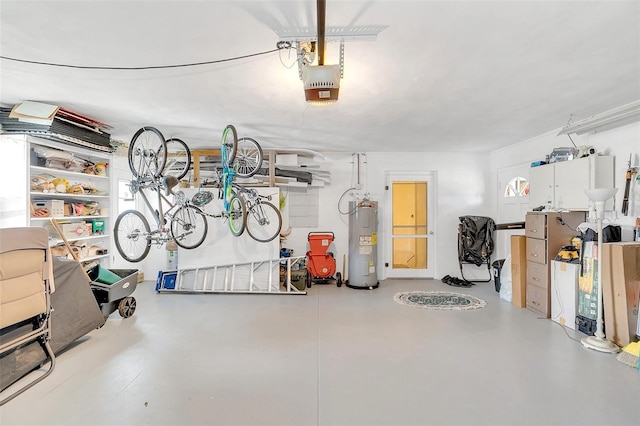 garage with a garage door opener and electric water heater