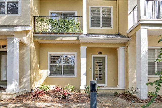 doorway to property featuring a balcony