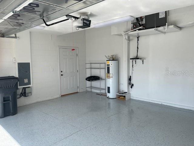 garage featuring a garage door opener and water heater