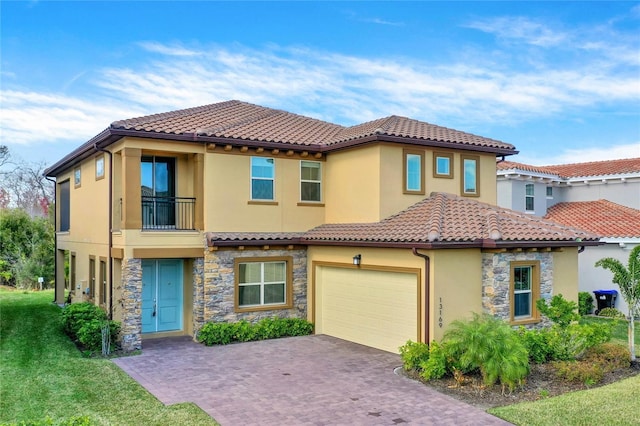 mediterranean / spanish-style home with a garage