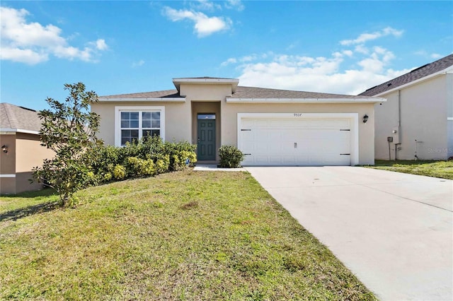 view of front of property with a garage and a front yard