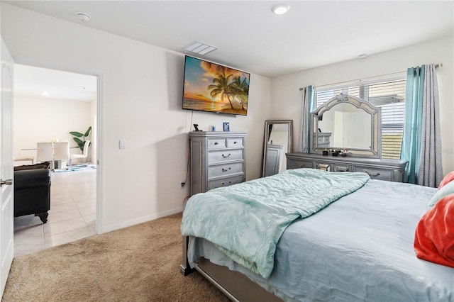 bedroom featuring light colored carpet