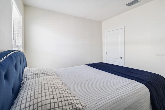 bedroom featuring multiple windows