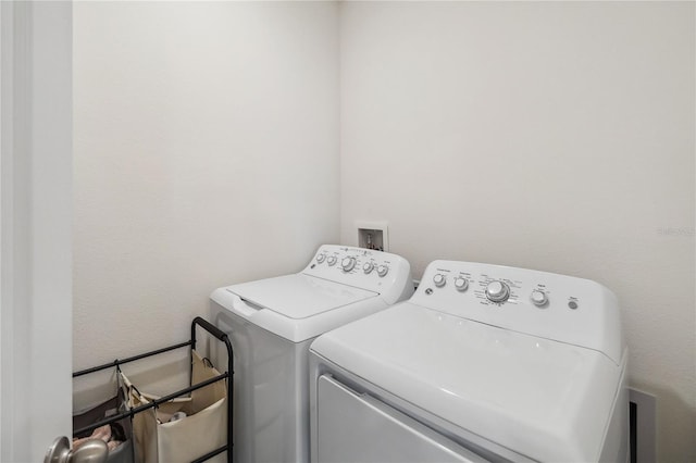 clothes washing area featuring washing machine and dryer