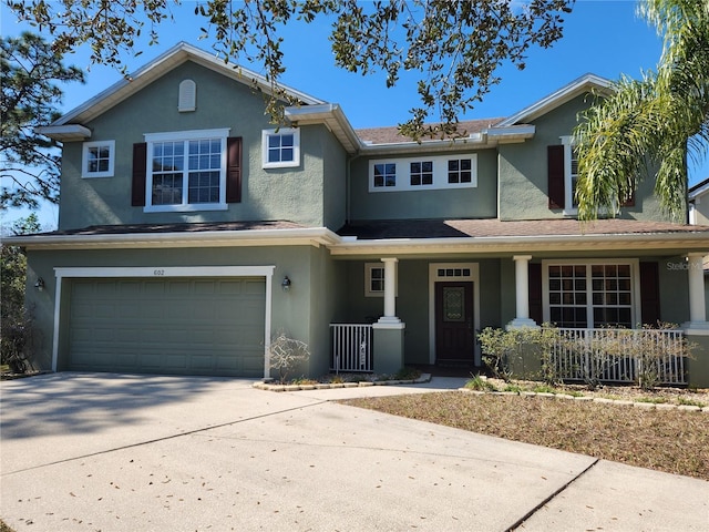 view of front of house featuring a garage and a porch