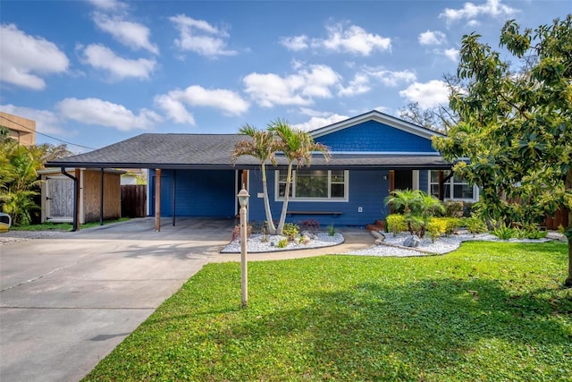 single story home with a carport and a front lawn