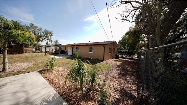 rear view of property with a yard, a patio area, and fence