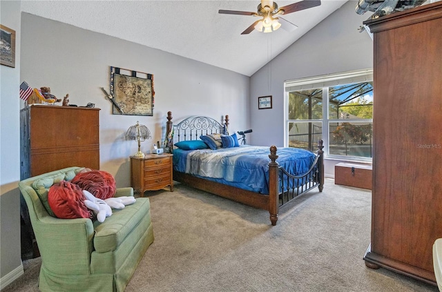 bedroom featuring lofted ceiling, carpet floors, a textured ceiling, and ceiling fan