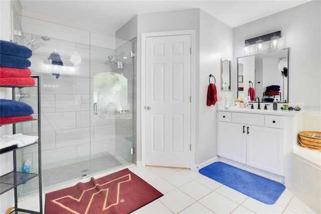 bathroom featuring a shower stall, vanity, and tile patterned floors