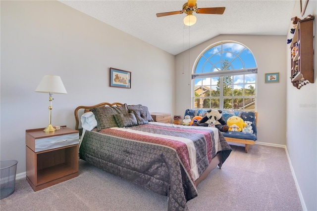 carpeted bedroom featuring a textured ceiling, ceiling fan, vaulted ceiling, and baseboards