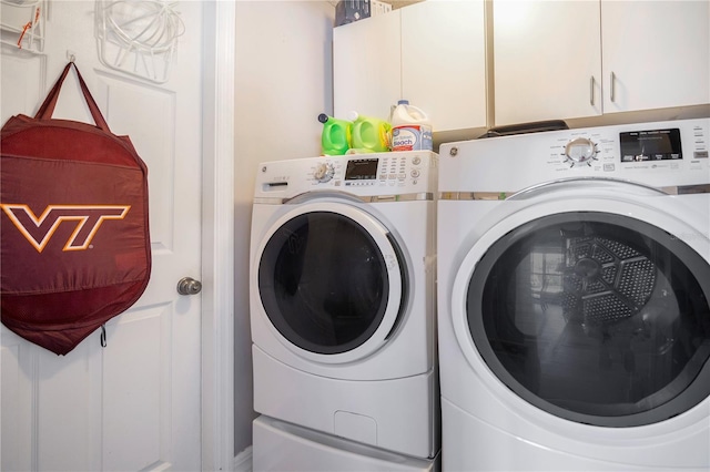 laundry area with cabinet space and washer and clothes dryer