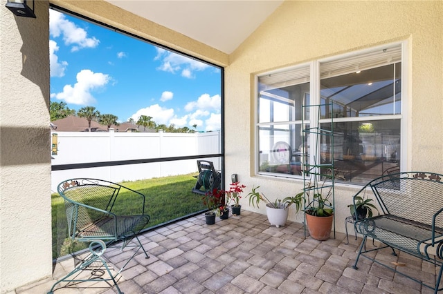 sunroom / solarium with vaulted ceiling