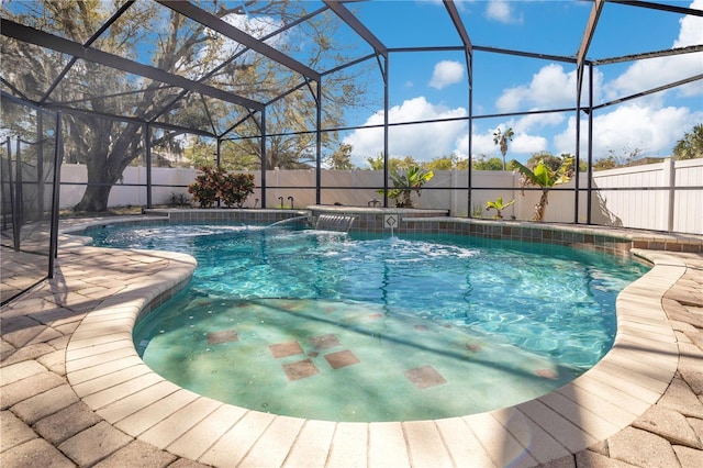 view of swimming pool with a lanai, a patio area, a fenced backyard, and a fenced in pool