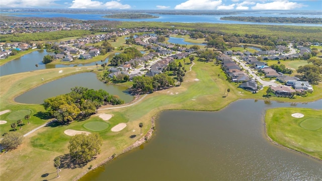 birds eye view of property with a residential view, a water view, and golf course view