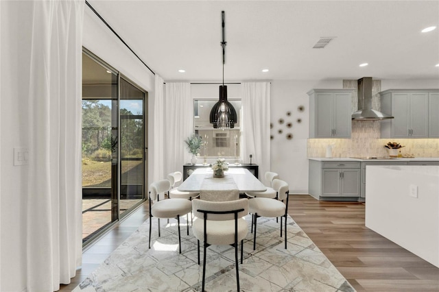 dining room featuring light hardwood / wood-style flooring