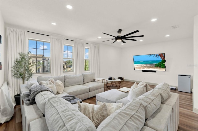 living room with hardwood / wood-style floors and ceiling fan