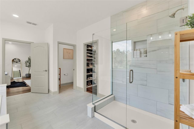 bathroom with a shower with shower door