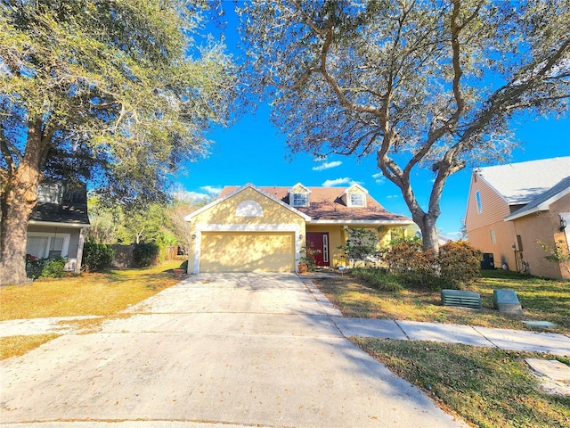 view of front of home featuring a garage and a front yard