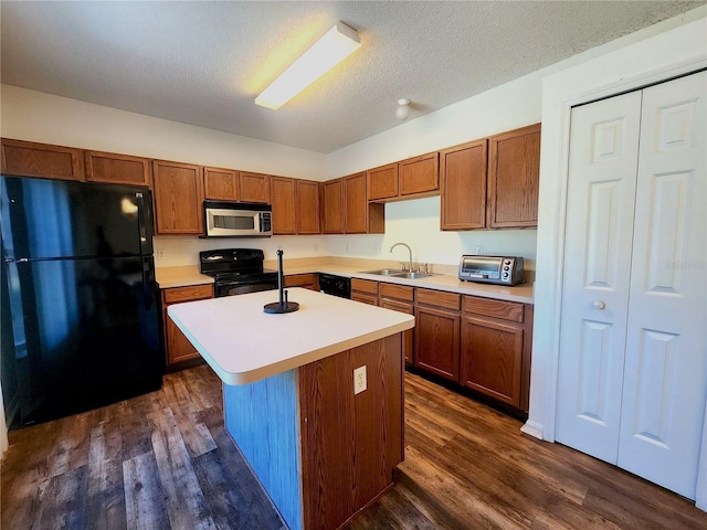 kitchen with dark hardwood / wood-style flooring, a center island, sink, and black appliances