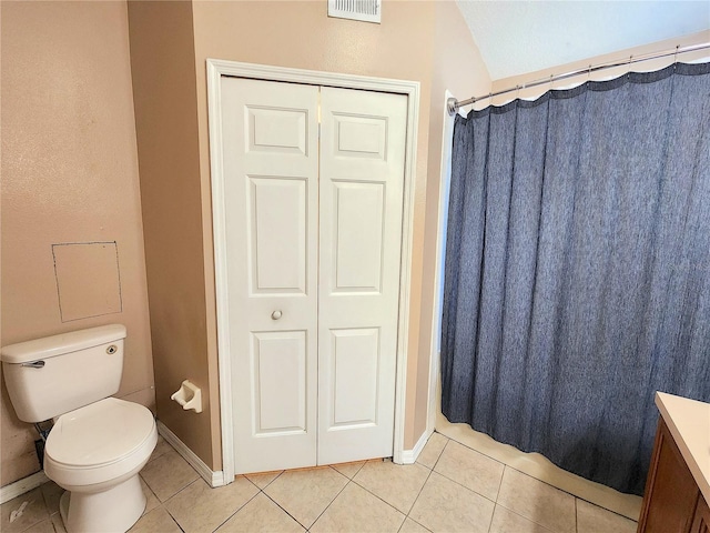 bathroom with tile patterned flooring, vanity, a shower with curtain, and toilet