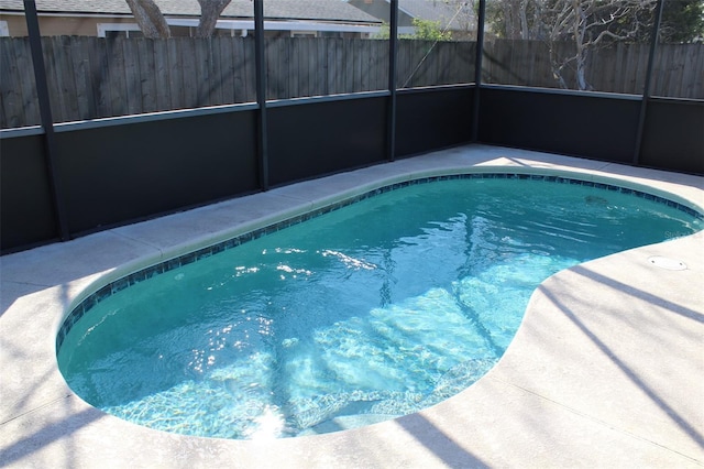 view of pool featuring a lanai and a patio