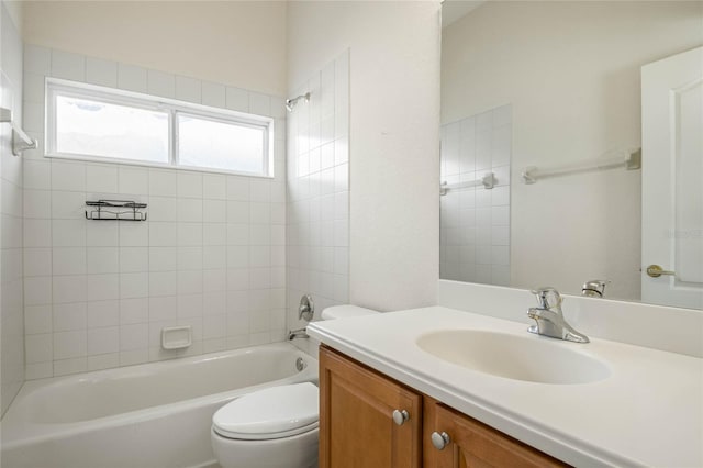 full bathroom featuring vanity, toilet, and tiled shower / bath combo