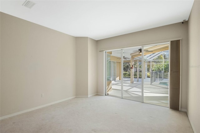 carpeted empty room featuring ceiling fan