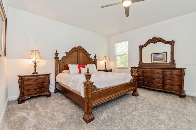 bedroom with ceiling fan, carpet, and baseboards