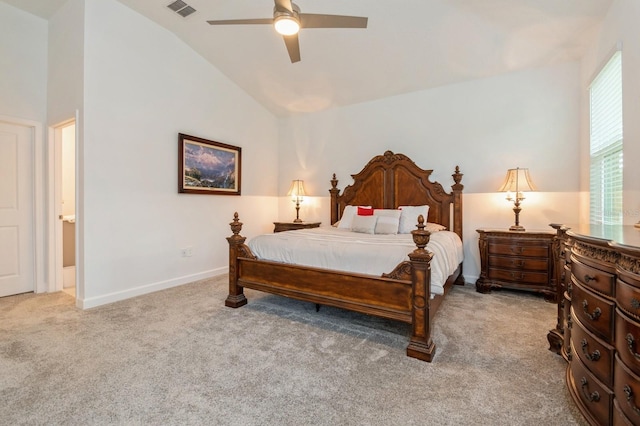 carpeted bedroom featuring baseboards, visible vents, vaulted ceiling, and a ceiling fan