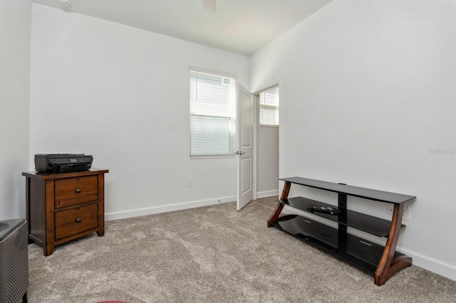 misc room with carpet and baseboards