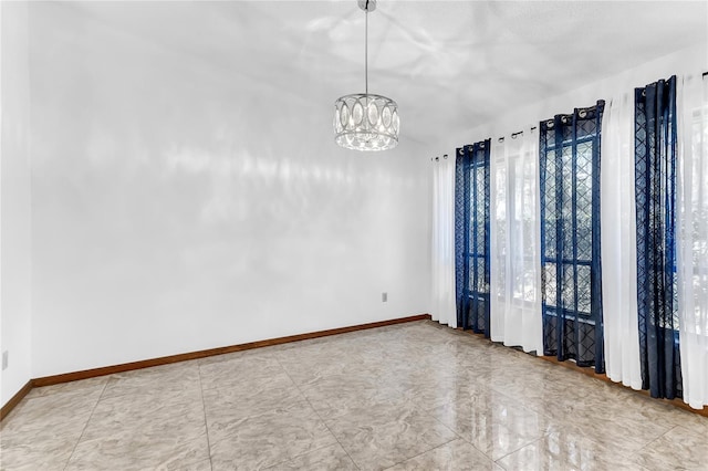 3547 Medford Rd, Casselberry, FL 32707 - unfurnished room featuring baseboards and a chandelier