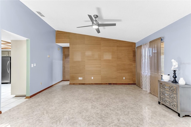 3547 Medford Rd, Casselberry, FL 32707 - unfurnished living room with lofted ceiling, a ceiling fan, wood walls, and an accent wall