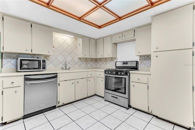 3547 Medford Rd, Casselberry, FL 32707 - kitchen with appliances with stainless steel finishes, light countertops, and decorative backsplash