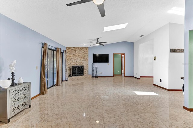 3547 Medford Rd, Casselberry, FL 32707 - unfurnished living room with ceiling fan, lofted ceiling, a fireplace, and a skylight