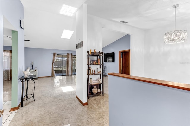 3547 Medford Rd, Casselberry, FL 32707 - corridor featuring vaulted ceiling, a skylight, and a chandelier