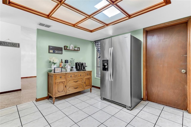3547 Medford Rd, Casselberry, FL 32707 - kitchen featuring stainless steel refrigerator with ice dispenser, light tile patterned floors, and light countertops
