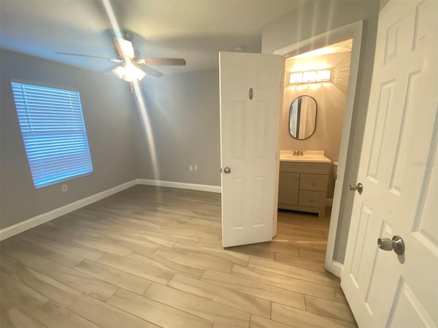 unfurnished bedroom with light hardwood / wood-style floors and ceiling fan