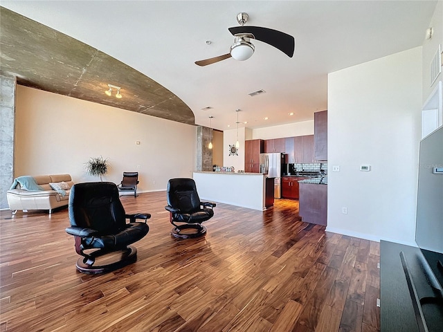 living room featuring dark hardwood / wood-style floors and ceiling fan