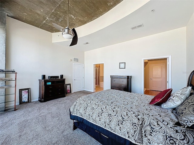 bedroom featuring ceiling fan and carpet