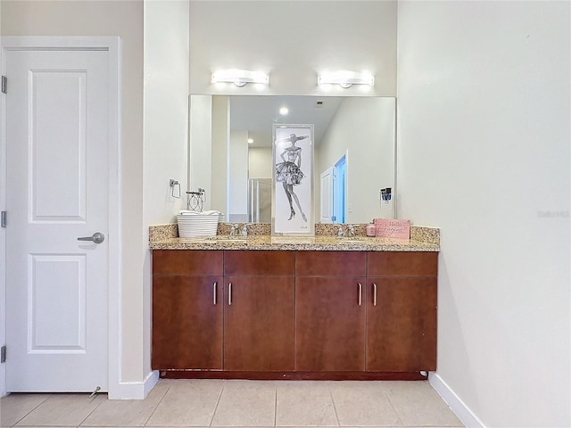 bathroom featuring vanity and tile patterned flooring