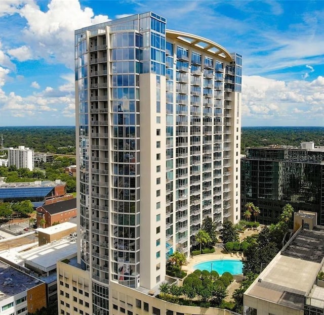 view of building exterior featuring a community pool