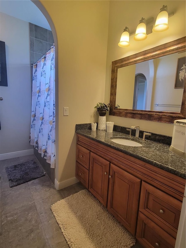 bathroom featuring vanity and a shower with shower curtain